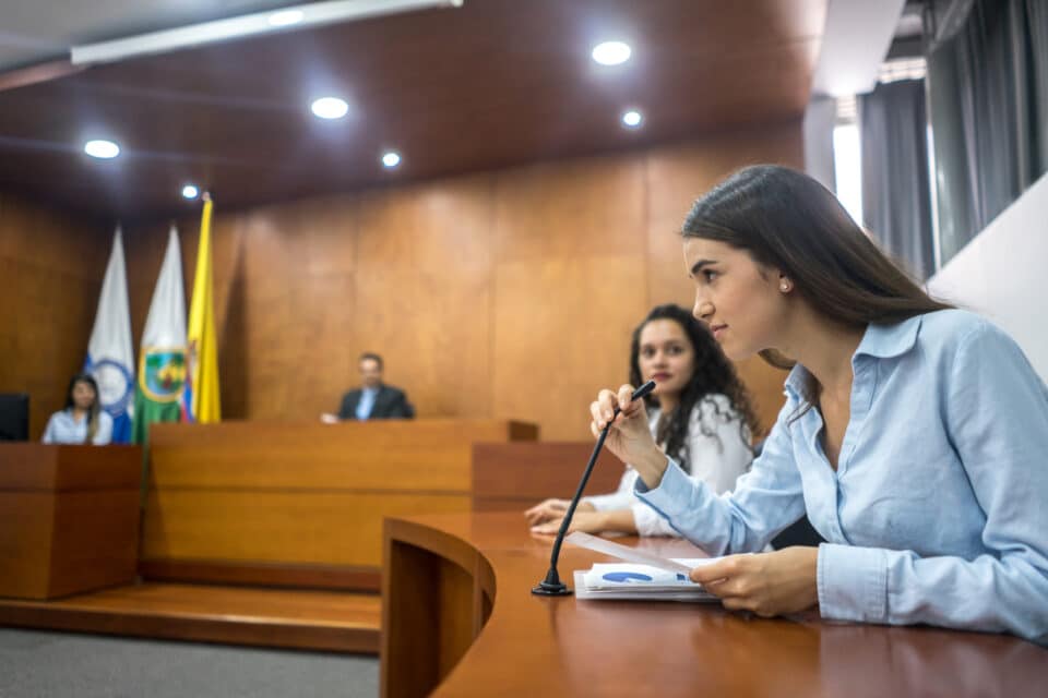 Young woman addressing the court.